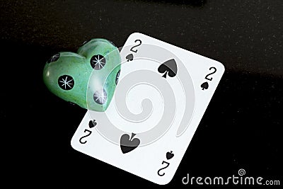 Playing card and stone love Stock Photo