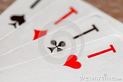 Playing cards, aces of hearts, clubs, diamonds, spades, macro close-up, selective focus Stock Photo