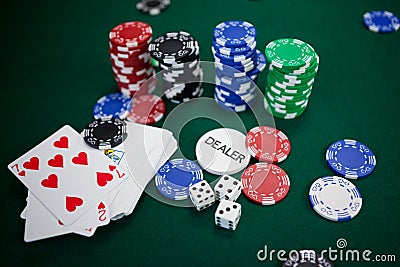 Playing cards, dices and casino chips on poker table Stock Photo