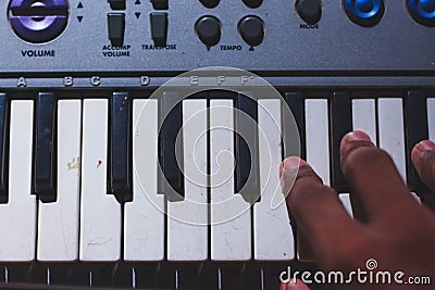 Playing Electronic Keyboard from top view composition in Music Recording studio close up on hands. Playing electronic Piano Stock Photo