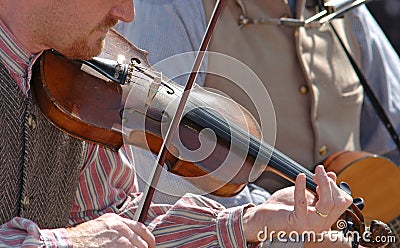 Playing the fiddle Stock Photo