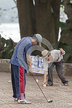 Playing golf Editorial Stock Photo