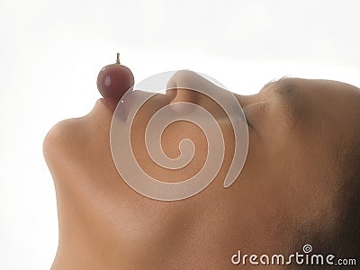 Playing with grape Stock Photo