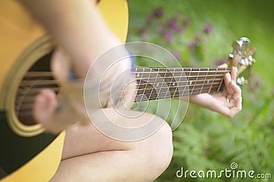 Playing Guitar in forest Stock Photo