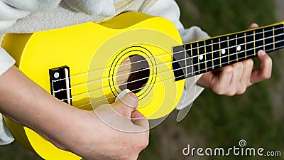 playing the guitar strings with a plectrum Stock Photo