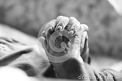 Playing hands of an elderly woman Stock Photo