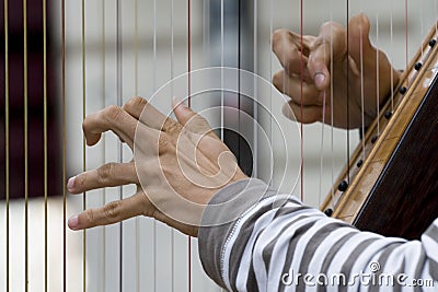 Playing the harp Stock Photo