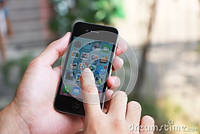 Playing iphone Editorial Stock Photo