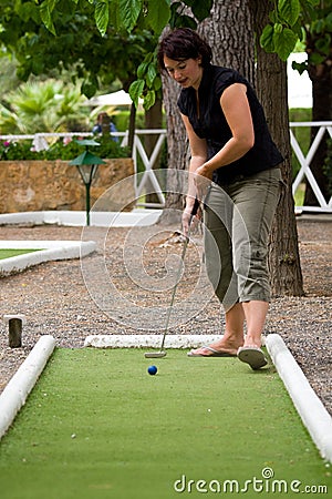 Playing midget-golf Stock Photo