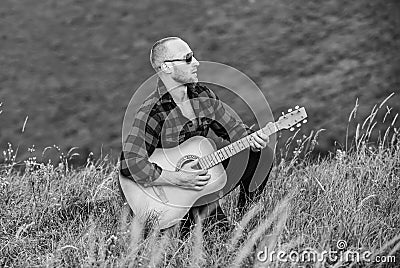 Playing music. Sound of freedom. Musician hiker find inspiration in mountains. In unison with nature. Keep calm and play Stock Photo
