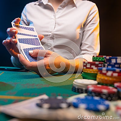 Playing poker in a big casino. Online business playing cards, big bets and money. Casino background. Winning and success, risk and Stock Photo