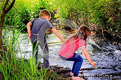 Playing by a Stream Stock Photo