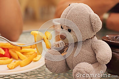 Playing with a teddy bear Stock Photo