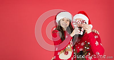 Playing together. Joy and happiness. Christmas Carol. Father and daughter with candy canes christmas decorations. Family Stock Photo