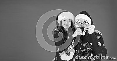 Playing together. Joy and happiness. Christmas Carol. Father and daughter with candy canes christmas decorations. Family Stock Photo