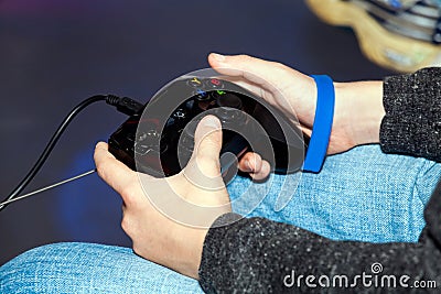 Playing in video computer games with joystick Stock Photo