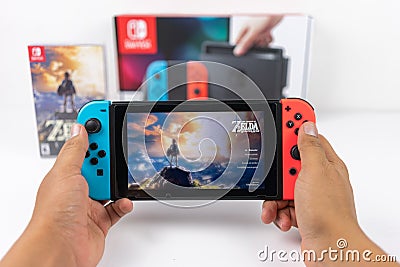 Playing Zelda breath of the wild in Nintendo Switch Editorial Stock Photo