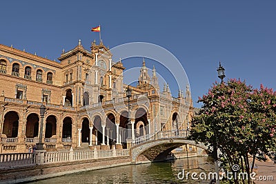 Historical buildings, archway and canal with bridgee on Plaza Espana, Seville Editorial Stock Photo