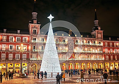 Plaza Mayor square illuminated by a shinny christmas tree. Madrid, Spain Editorial Stock Photo