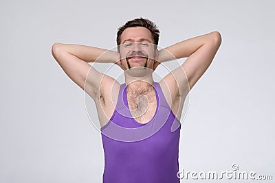 Pleasant attractive content cheerful man with funny mustache being proud of himself Stock Photo