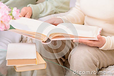 Pleasant couple looking through photo album Stock Photo