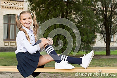 Pleasant minutes of rest. Relaxing in school yard. Perfect schoolgirl relaxing between classes. Life balance. Student Stock Photo