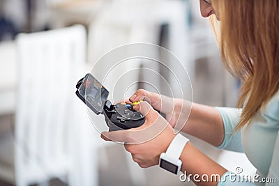 Pleasant senior woman holding game console Stock Photo