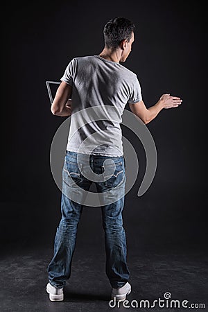 Pleasant young man touching the sensory panel Stock Photo