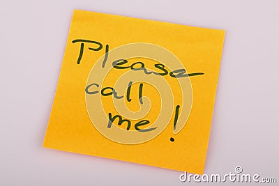 Please call me note on orange sticker note on white Stock Photo