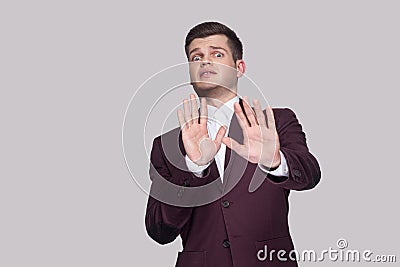 Please don`t touch me. Portrait of scared handsome young man in Stock Photo