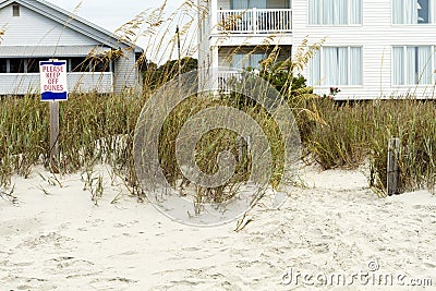 Please Keep Off Dunes Sign and Beach Houses Stock Photo