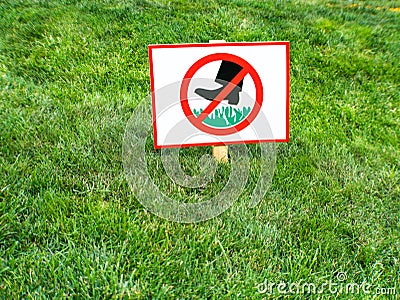 Please keep off the grass sign attention Stock Photo