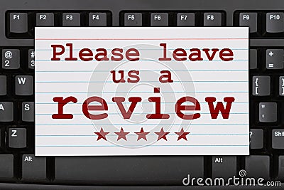 Please leave a review message on a black keyboard Stock Photo