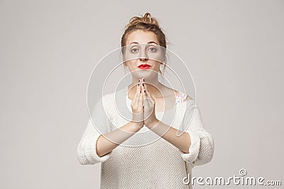 Please sorry! Hopeless woman hope, wish or apologize . Stock Photo