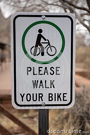Please Walk Your Bike Sign Along Trail In Zion Stock Photo