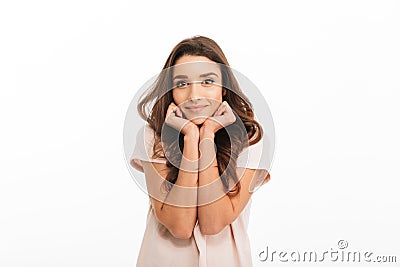 Pleased brunette woman in t-shirt reclines on her hands Stock Photo