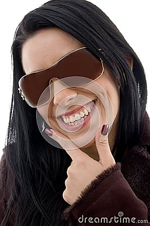 Pleased female wearing sunglasses on white backgro Stock Photo