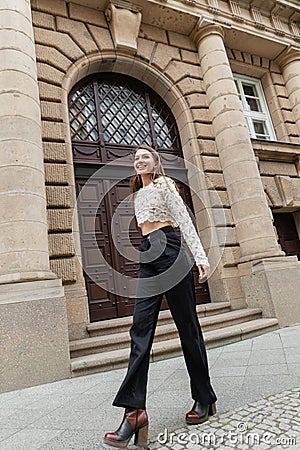 pleased young woman in lace top Stock Photo