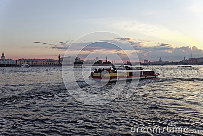 Pleasure boats on the Neva river in Saint Petersburg, Russia. Cityscape view in sunset Editorial Stock Photo