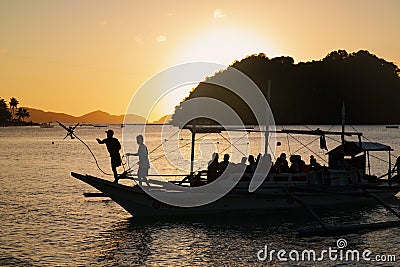 Pleasure ship with tourists on the sunset drops anchor on the Las Cabanas beach Editorial Stock Photo