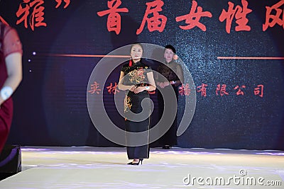 pleuche-Female cheongsam show Editorial Stock Photo