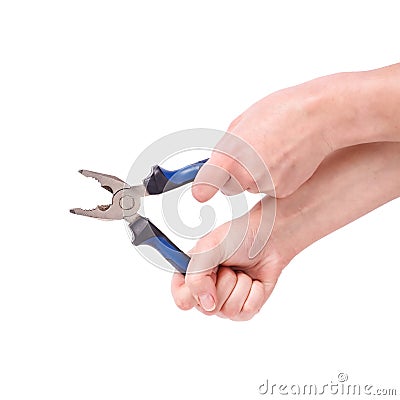 Pliers in the hand of a girl. Symbol of hard work, feminism and labor day. Isolate on white background Stock Photo
