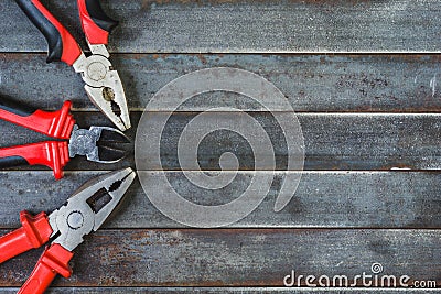 The pliers, on the old rusty table. Stock Photo