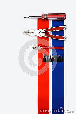 Pliers screwdriver metal pliers screwdriver cutter flag red blue white ribbon bow postcard background labor Dutch Stock Photo