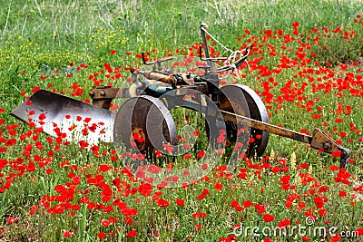 Plough and poppies Stock Photo