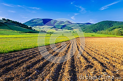 A ploughed field with the Mount Pennino in the background. Stock Photo