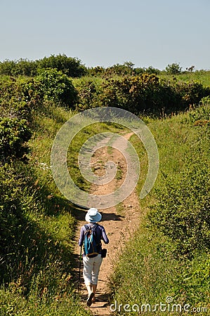 PLOUHA, FRANCE -May25 2017 : Hiker on the GR34 at Plouha Editorial Stock Photo