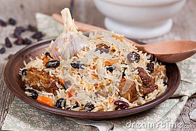 Plov, pilaf with rice, meat, raisins Stock Photo