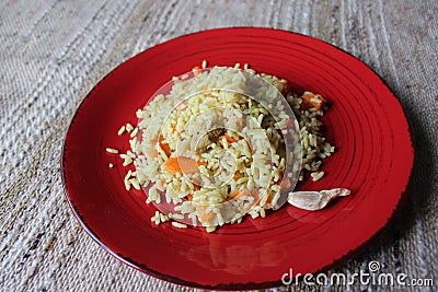 Plov. Vegan fresh tasty dish. rise with carrot, soya meat and garlic Stock Photo