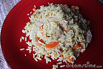 Plov. Vegan fresh tasty dish. rise with carrot, soya meat and garlic Stock Photo